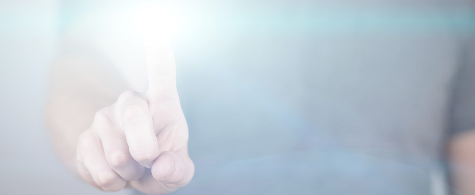 Close-up of a person touching a bright light or virtual button with their index finger.